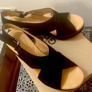 Women’s black suede sandals by Clark’s